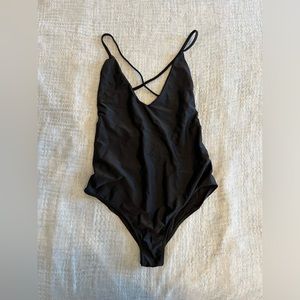 Black strappy one piece bathing suit